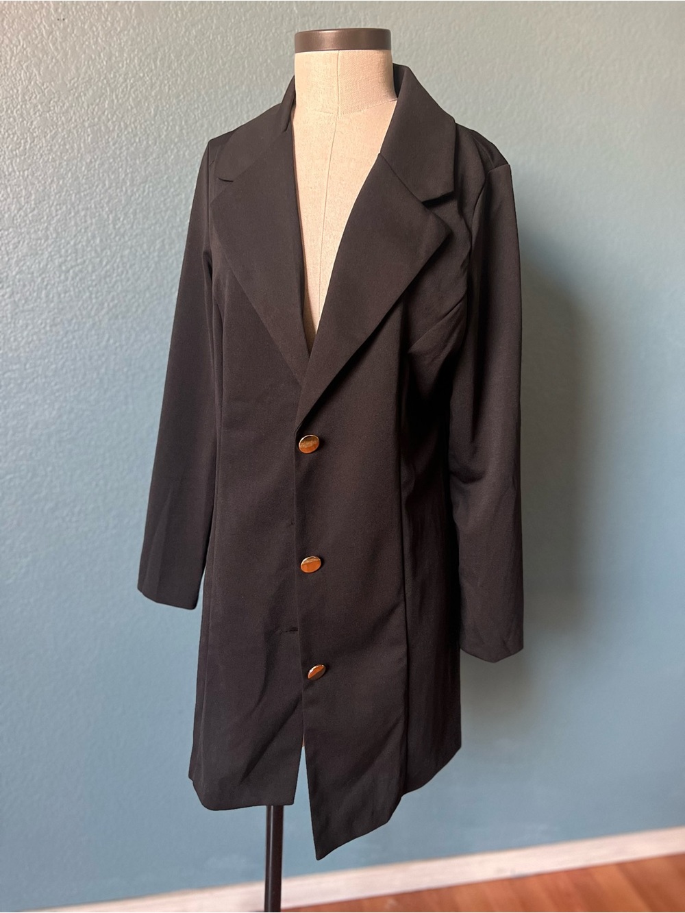 Women’s Sleek Black Longline Blazer with Notch Lapel and polished gold buttons